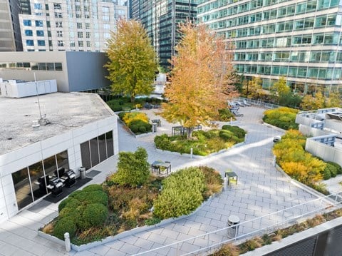 an aerial view of a city courtyard with trees and buildings at Presidential Towers, Illinois, 60661